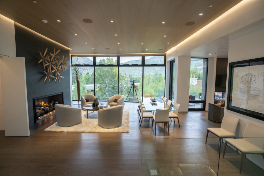 A living room featuring hidden in-ceiling Sonance speakers.