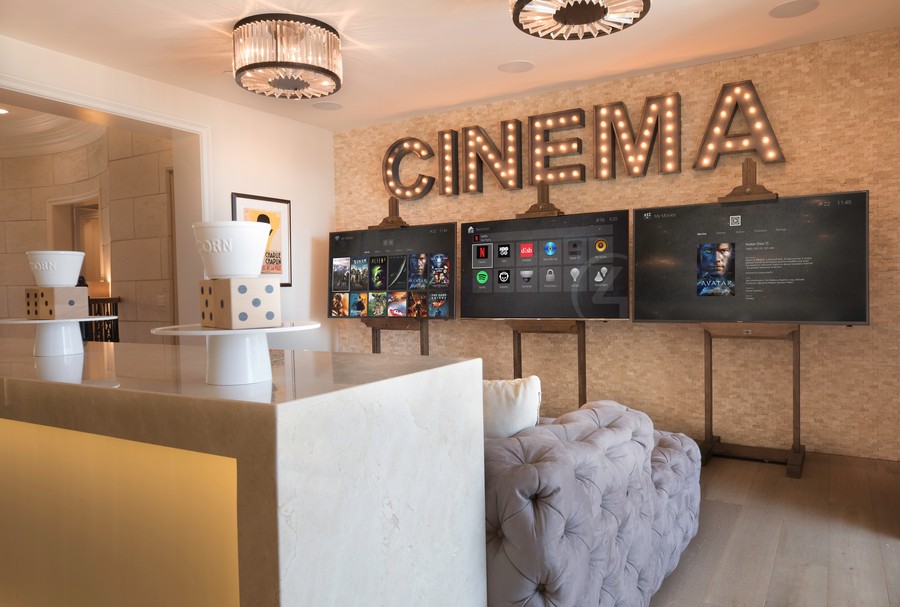 A media room video wall featuring three TV screens.