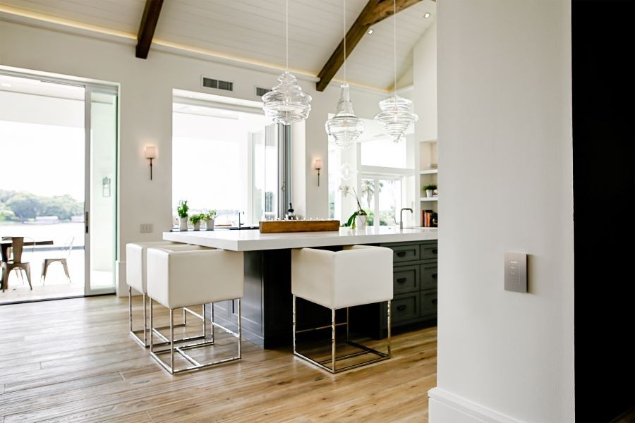 A Lutron keypad displayed on a wall in a well-lit kitchen.