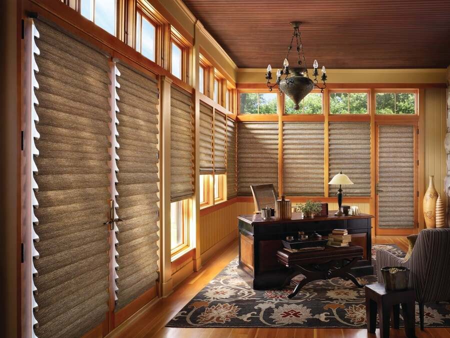 A luxury home office with Hunter Douglas shades.