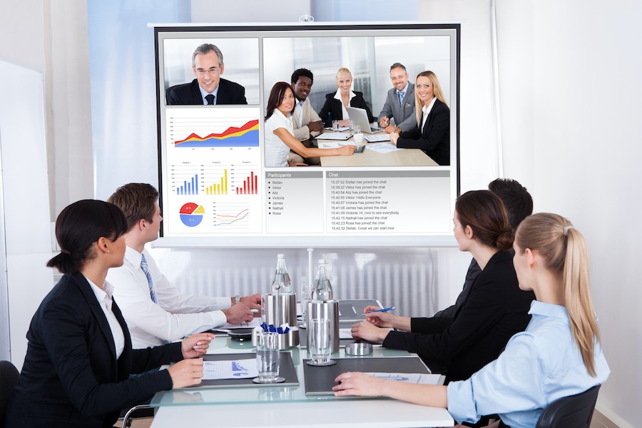 Business teams collaborate with video conferencing.