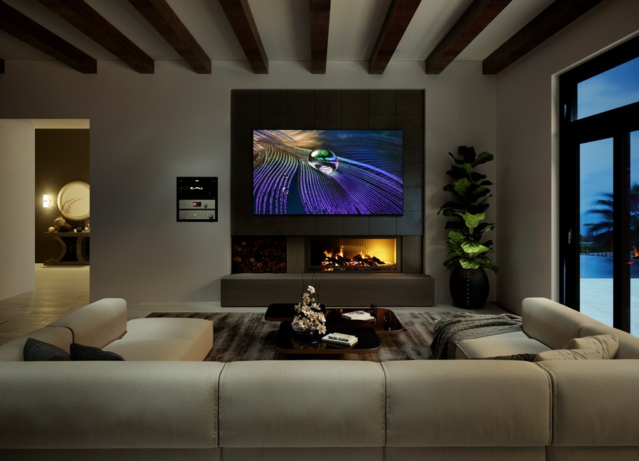 A Sony TV over a fireplace in a living room.